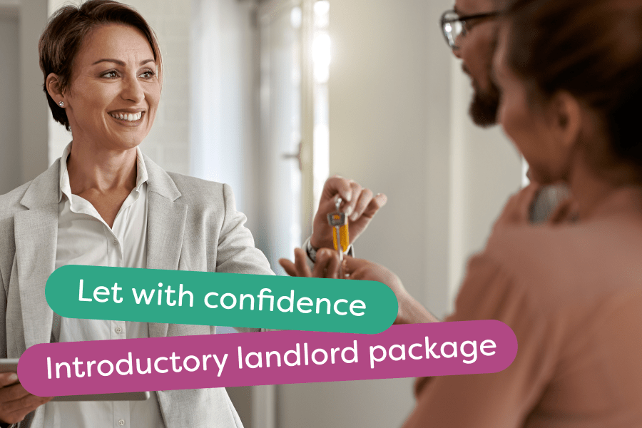 A letting agent handing keys over to new tenants